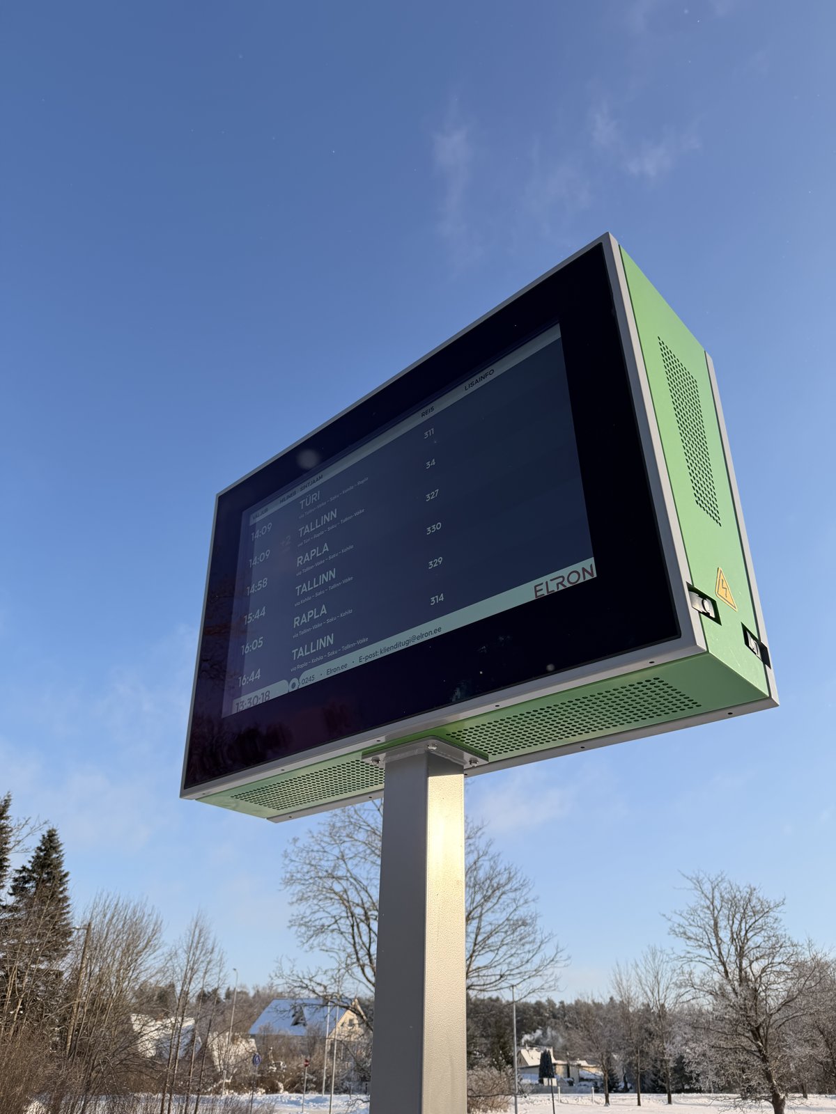 Close-up of the dual-sided 49-inch outdoor LCD enclosure on the Edelaraudtee network