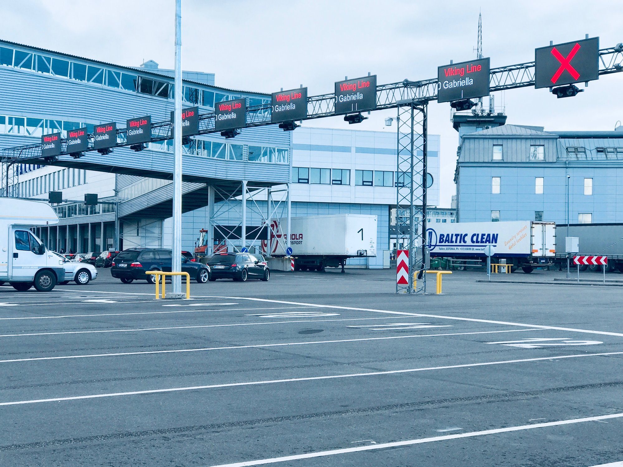Numbered lane sign on a gantry at the Port of Tallinn showing lane 34 for Megastar to Helsinki.