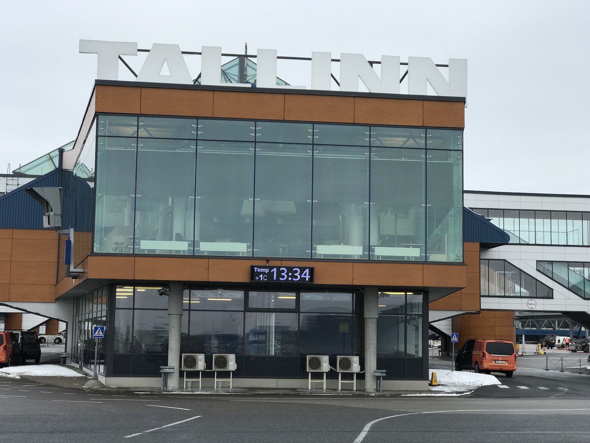 Ampron LED time display on the terminal building facade at Tallinn Airport.